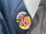 a close up of a jacket with a badge on it