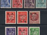 a close up of a group of stamps on a black surface