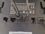 a close up of a laptop with a cable connected to it