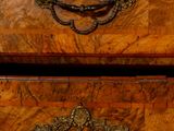 two wooden drawers with metal handles on each of them