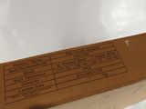 a cardboard box with a price label on it sitting on a table