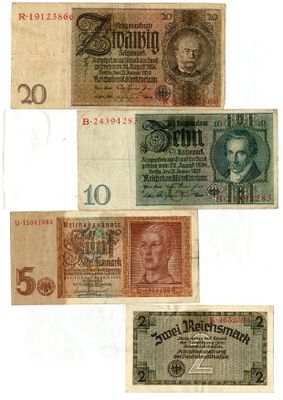 a group of five different bank notes on a white background