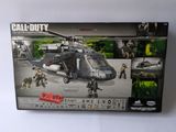 lego army helicopter with soldiers and weapons in box on white surface