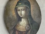painting of a woman wearing a green headdress in a white room