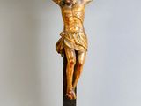 a statue of jesus on a cross on a table