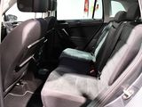 the back seats of a car with a seat belt in the back of it