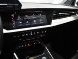 the interior of a car with a touch panel and a steering wheel