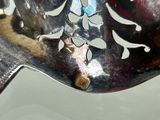 a close up of a spoon with a handle on a table