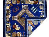 an image of a blue scarf with a picture of a boat and other things