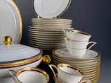 a lot of plates and cups on the table