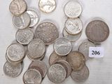 a lot of coins sitting on a table with a price tag