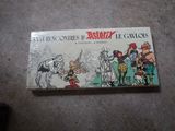 a close up of a box of comics on a floor
