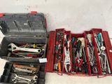 many tools in a red toolbox on the floor