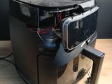 an image of a coffee maker on a wooden table