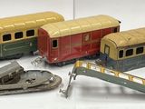 a lot of toy trains that are sitting on a table