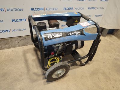 a blue portable generator sitting on top of a cement floor