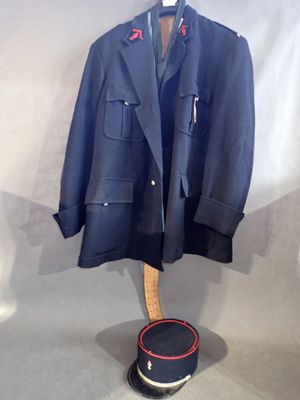 jacket on a mannequin stand with a hat on it