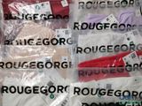 several pairs of underwear are wrapped in plastic bags on a table