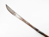 an old knife with a wooden handle on a white surface