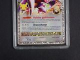 a close up of a pokemon card in a plastic case