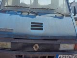 a blue van that is parked on the side of the road
