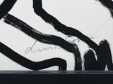 a black and white picture of a painting on a wall