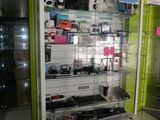 a display case with many different electronics on it