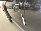 a reflection of a truck in the side mirror of a car