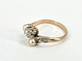 an image of a gold ring with a pearl and a diamond
