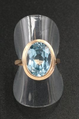 an image of a ring with a blue topaz stone
