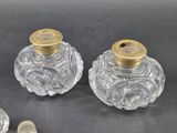 pair of antique cut glass perfume bottles with gold lids