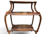 an old wooden shelf with three shelves on top of it