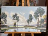 a painting that is on a easel in a room