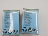 two boxes of cigarettes sitting on top of a white table