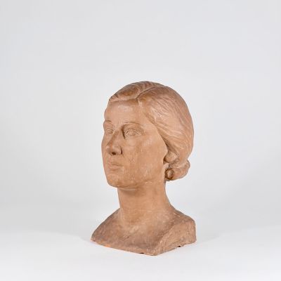statue of a woman ' s head on a white surface with a white background
