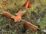 a rusted airplane sitting in the middle of a field