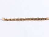 a close up of a gold chain bracelet on a white background
