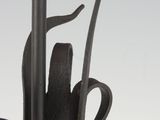 a close up of a metal sculpture with a flower on top of it