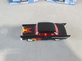 a toy car that is sitting on the floor