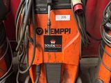 two welding machines sitting next to each other on the floor