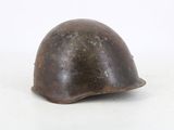 an old helmet on a white surface with a white background