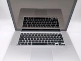 a silver laptop computer sitting on top of a white table