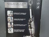 the box of the bissell vacuum is open on the table
