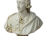 buste en marbre représentant un homme vêtu d'une blouse blanche et portant un collier en or
