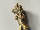 a gold figurine of a horse with a rider on it