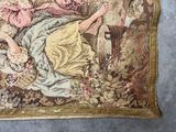 a picture of a tapestry with a woman sitting on a chair