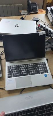 two laptops that are sitting on a desk