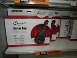 a guitar bag on a shelf in a store