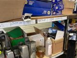 a shelf full of assorted items in a garage