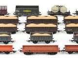 a lot of toy trains that are sitting on a table